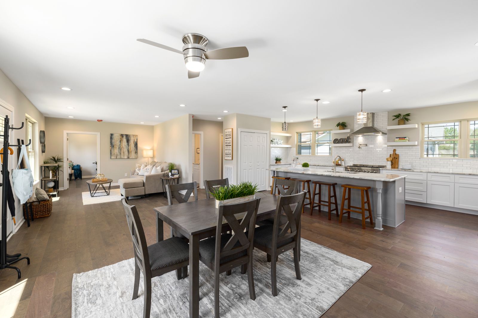 Open-concept whole-home renovation with connected living and dining areas